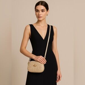 Vivienne Westwood Gold Crossbody Bag clutch with removable adjustable strap.